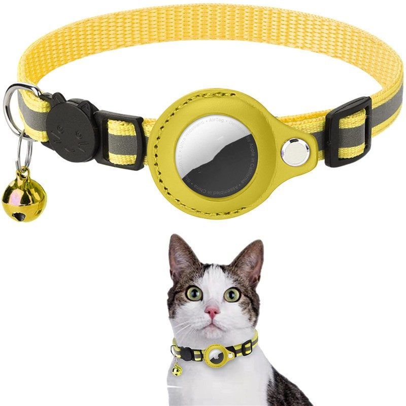 Yellow cat collar with a bell on a white background
